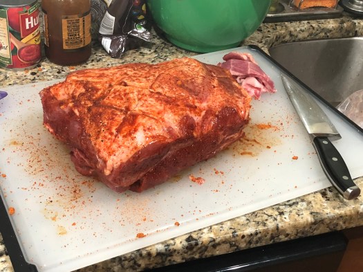 Pork butt after being cleaned up and seasoned 
