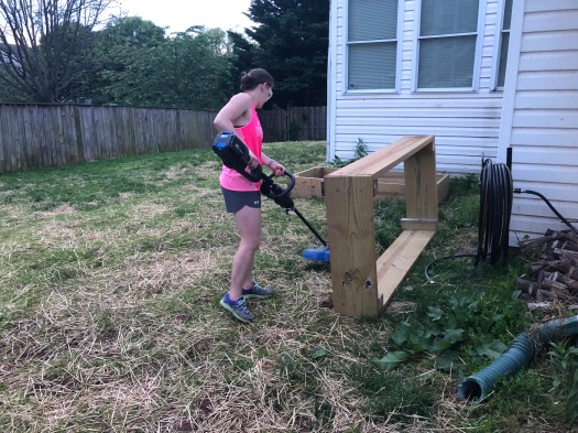 Danielle clearing grass from bed location